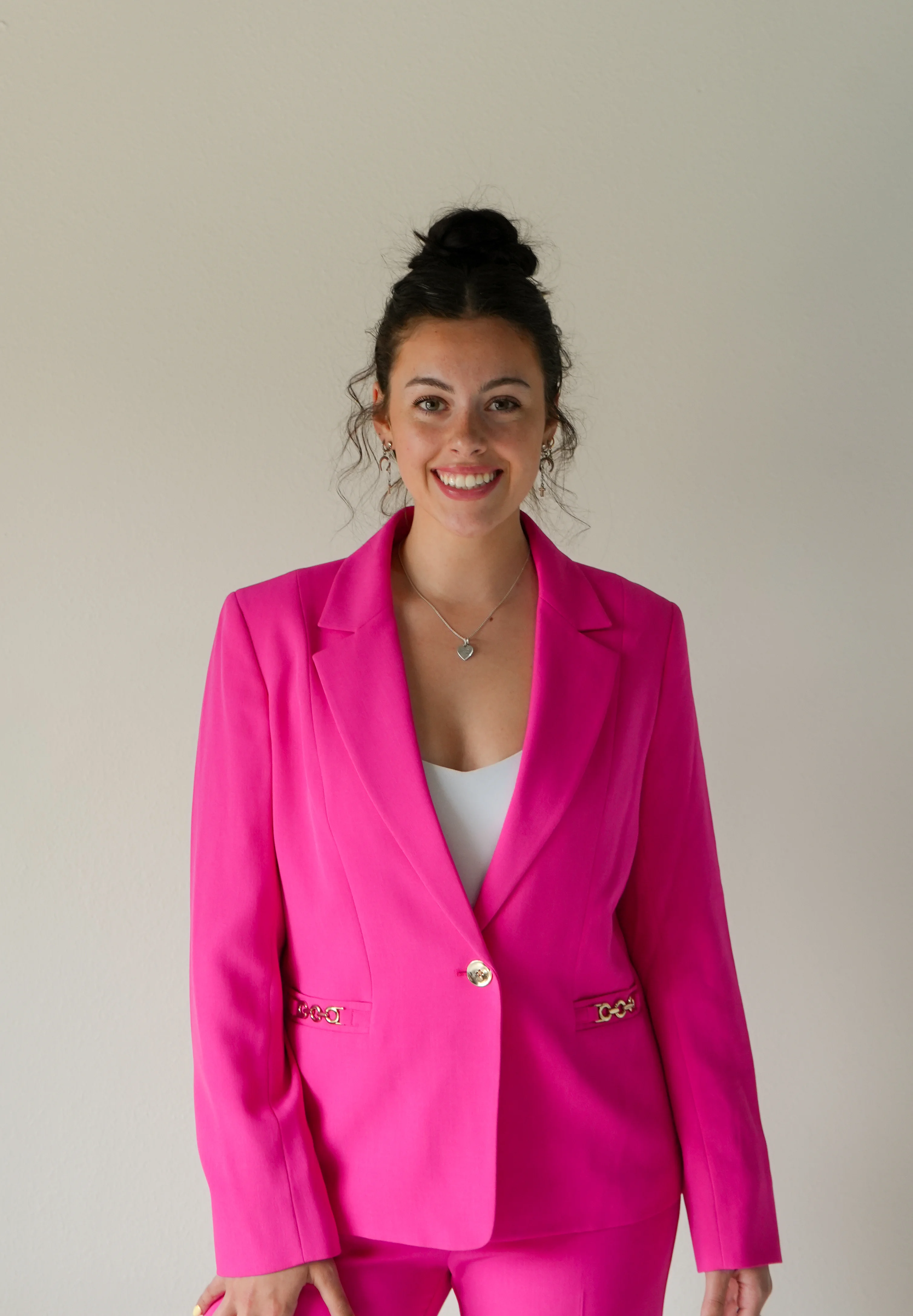 Baylie Mason, founder of Precision Collective, in a pink suit