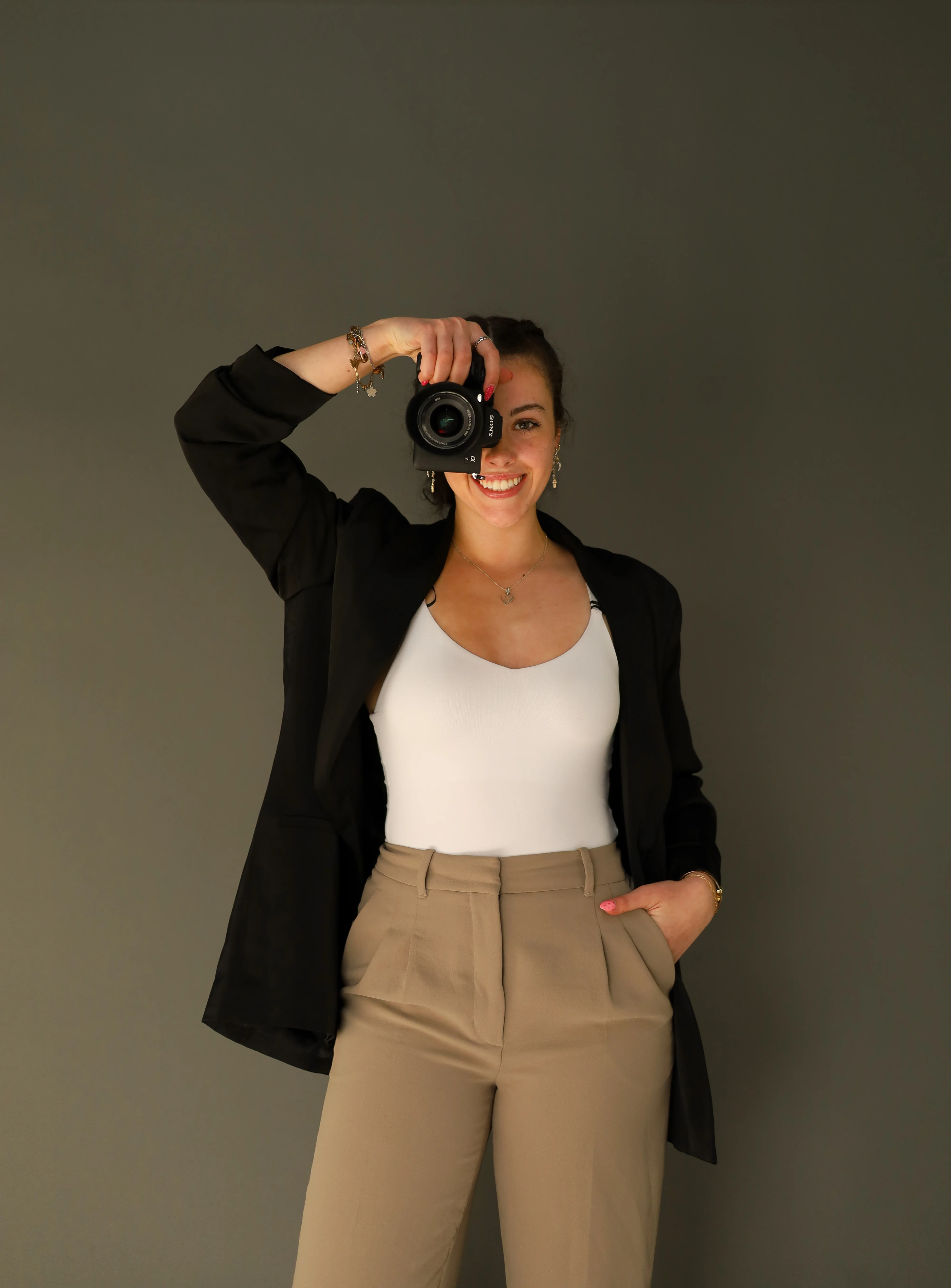 Camera and brand materials arranged for a photography session