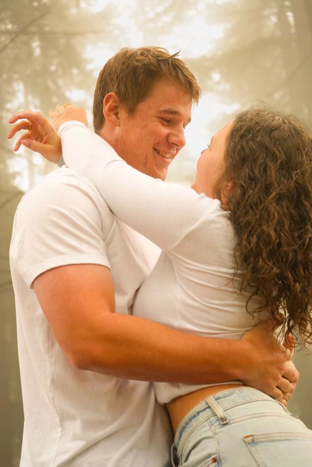 Couple embracing during a golden-hour portrait session
