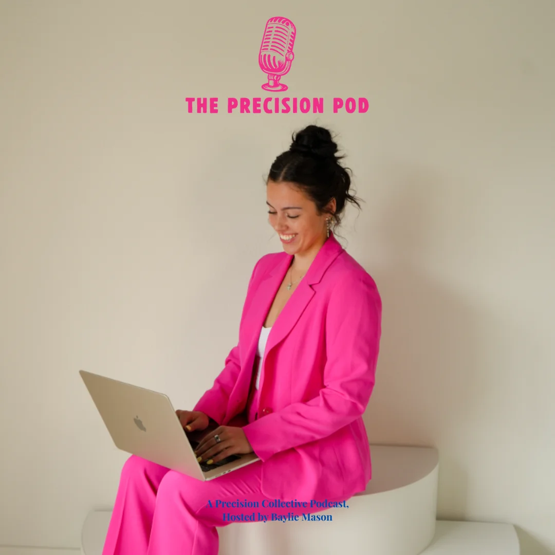 Baylie Mason hosting The Precision Pod, seated with a laptop in a pink suit